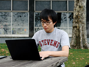 Photo of a student working on his laptop outside. Link to Gifts by Will. Photo of a student working on his laptop outside. Link to Gifts by Will.
