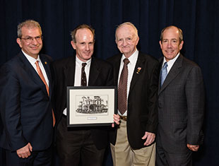 Group of people in suits holding a photo. Link to Life Stage Gift Planner Under Age 60 Situations. Group of people in suits holding a photo. Link to Life Stage Gift Planner Under Age 60 Situations.